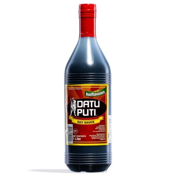 Bottle of Datu Puti soy sauce with a red cap on a white background