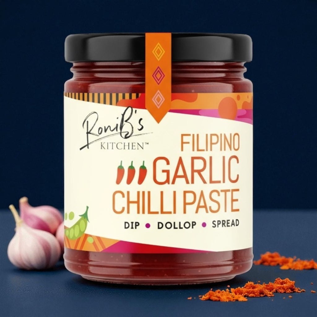 Jar of RoniB's Kitchen Filipino Garlic Chilli Paste with garlic and chili on a dark background