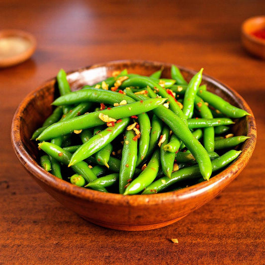 Fresh sautéed green beans tossed in garlic and chilli oil, served in a rustic wooden bowl — Filipino-inspired vegetable side dish.