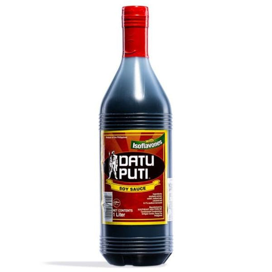 Bottle of Datu Puti soy sauce with a red cap on a white background